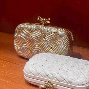 Bottega Veneta gold woven knot clutch in gift box with branded packaging