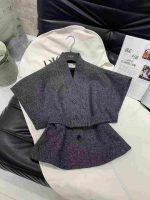 Black midi dress and a grey cardigan or cropped jacket. - Image 5