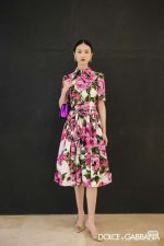 A short-sleeved women's dress with a pink floral print
