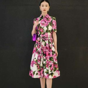 A short-sleeved women's dress with a pink floral print
