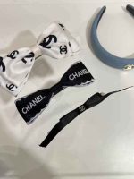 Elegant Chanel-style black and white bow hair clips with pearl accents – luxury hair accessories for women