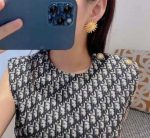 Sun-shaped gold earrings - Image 2