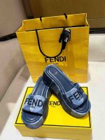 Fendi denim platform slides with embroidered logo and yellow Fendi packaging