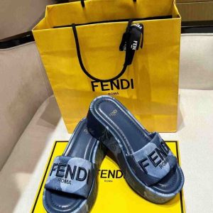 Fendi denim platform slides with embroidered logo and yellow Fendi packaging