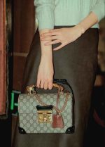 Gucci Padlock Bag with bamboo handle in brown monogram canvas and leather sides, gold hardware, and top flap lock