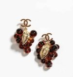 Chanel Camellia floral drop earrings with luxury logo detail