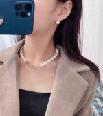 Elegant gold pearl stud earrings with lustrous round pearls