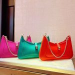 Pink, aqua, and red designer chain bags with snakehead clasp