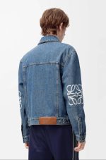 Stylish black denim jacket with unique embroidery design on sleeves