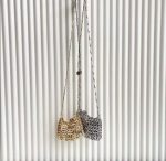 Stunning silver clutch bag with chic chain-link design, perfect for parties and special occasions