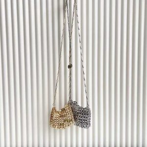 Stunning silver clutch bag with chic chain-link design, perfect for parties and special occasions