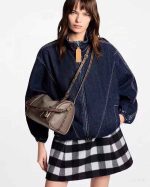 Versatile denim bomber jacket styled as effortlessly cool everyday outerwear