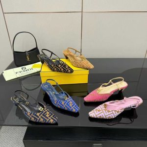 Fendi FF logo slingback flats in black, tan, brown, blue, pink, and blush pink colors displayed on a black table.