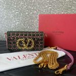 A collage of four beaded mini bags in different colors: pink, blue, turquoise, and black. Each bag features a large gold VLogo emblem and a chain strap.