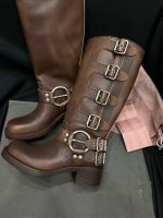 Brown mid-calf leather boots with multi buckle straps and block heel
