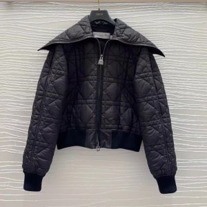 A full front view of a black quilted bomber jacket, highlighting the wide collar and zipper detail.