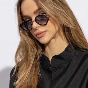 A collection of stylish sunglasses and Trendy Shades in various colors and styles, displayed elegantly on a tray.