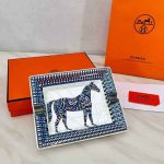 Set of three decorative plates with colorful designs in an elegant presentation box.