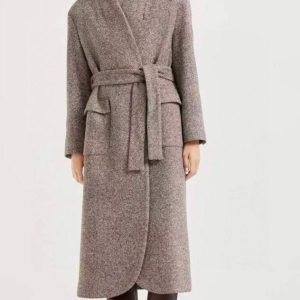 Elegant long wrap coat in a stylish winter outfit, featuring a belt and high collar.