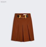 Brown pleated skirt with chain detail, perfect for stylish outfits.