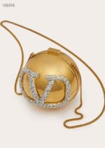 Chic mini beaded round crossbody bag with gold chain strap, perfect for casual or evening wear