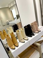 Luxury Black Ankle Boots with Metallic Lock Accent - Image 2